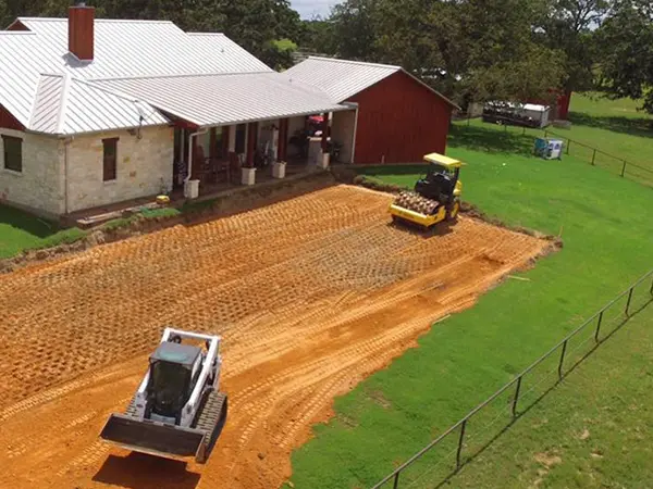 Two excavators in the backyard of a property