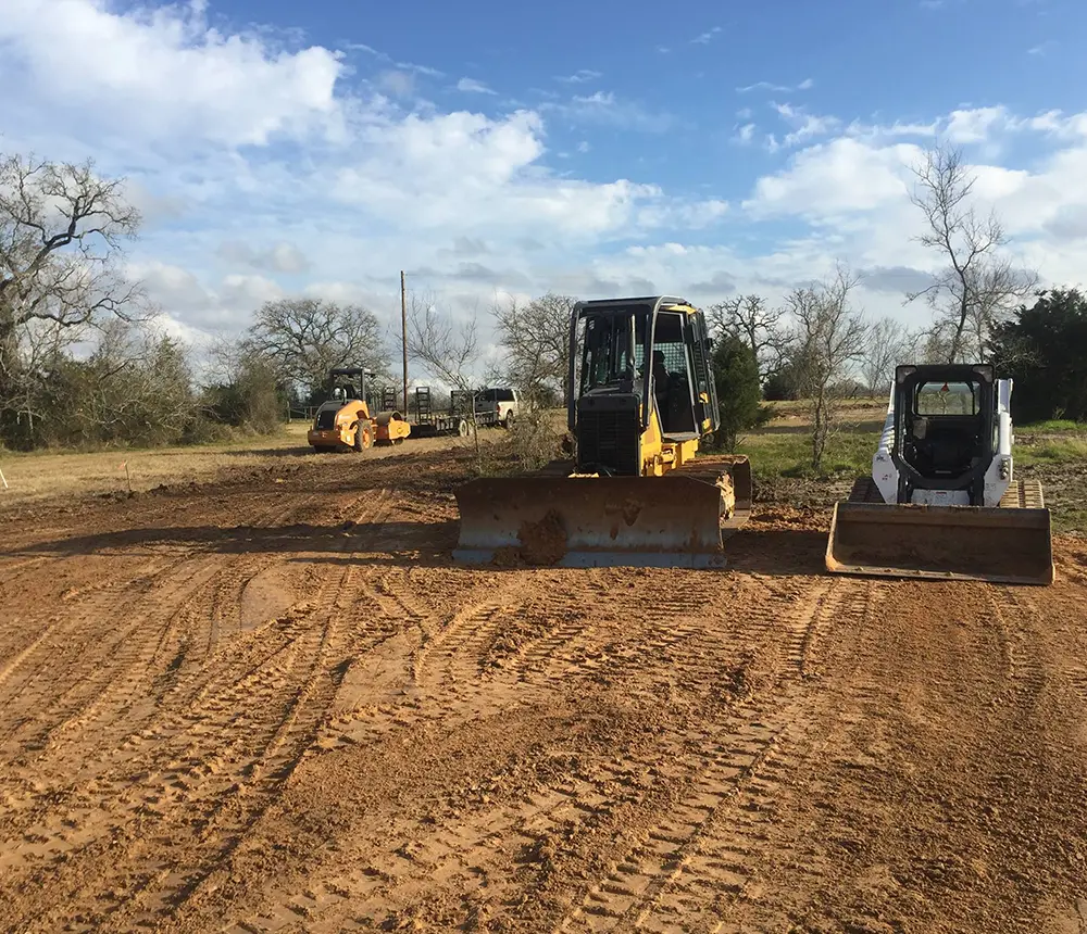 Two excavators in a field