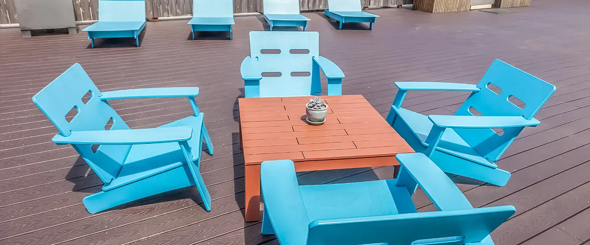 modern rooftop deck with blue polywood patio furniture