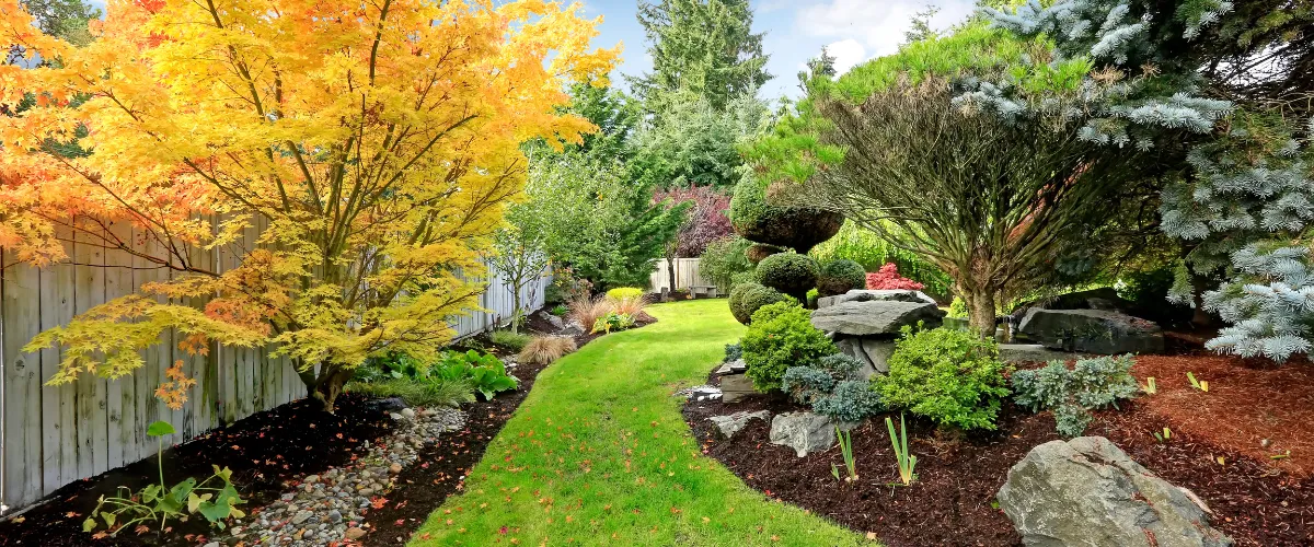 An aerial view of a meticulously designed garden landscape with colorful floral patterns.