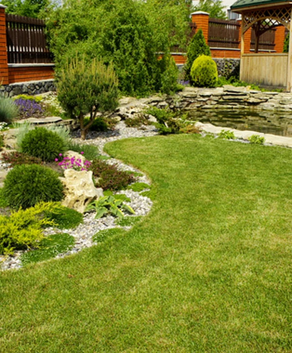 landscaping hardscaping southwood valley college station tx lush landscaped garden with vibrant flowers stone pathway and wooden gazebo